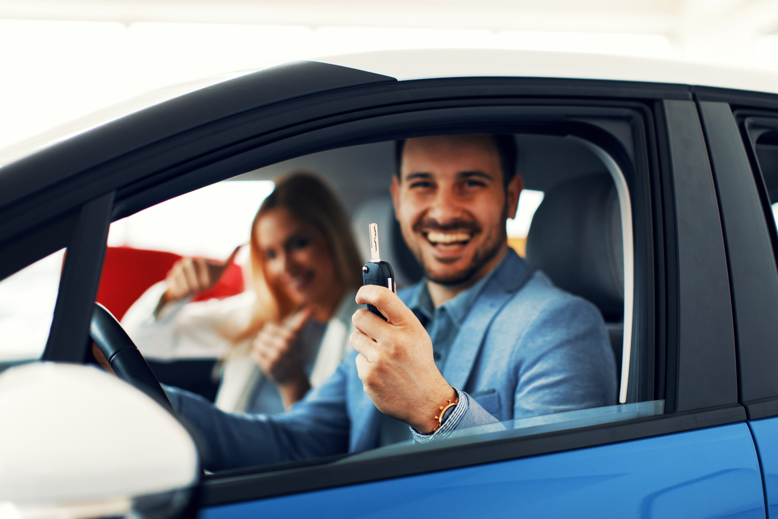 young couple holding the keys of a new car select 2023 04 03 23 35 08 utc scaled Tea Circle